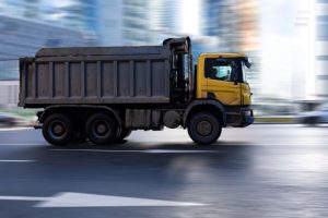 Dump Truck Accidents and How to Avoid Them - The Trucking Lawyers - Penn Keller Mcewen - Personal Injury Attorneys - Truck on Road
